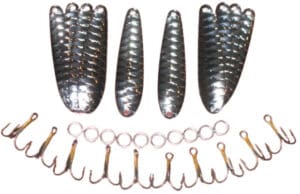 Fishing lures and hooks arranged on surface.